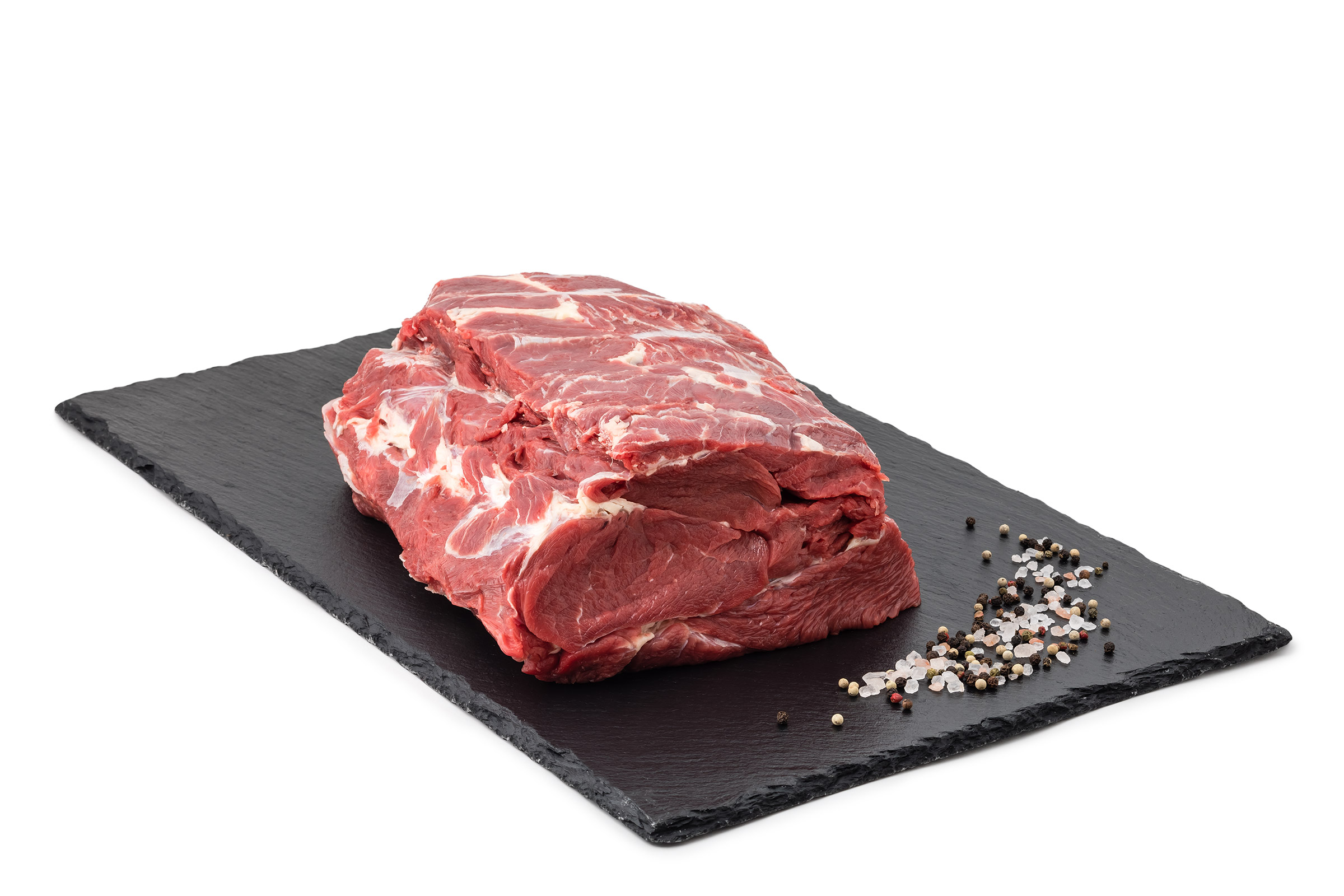 Rohes Fleisch auf schwarzem Steinbrett