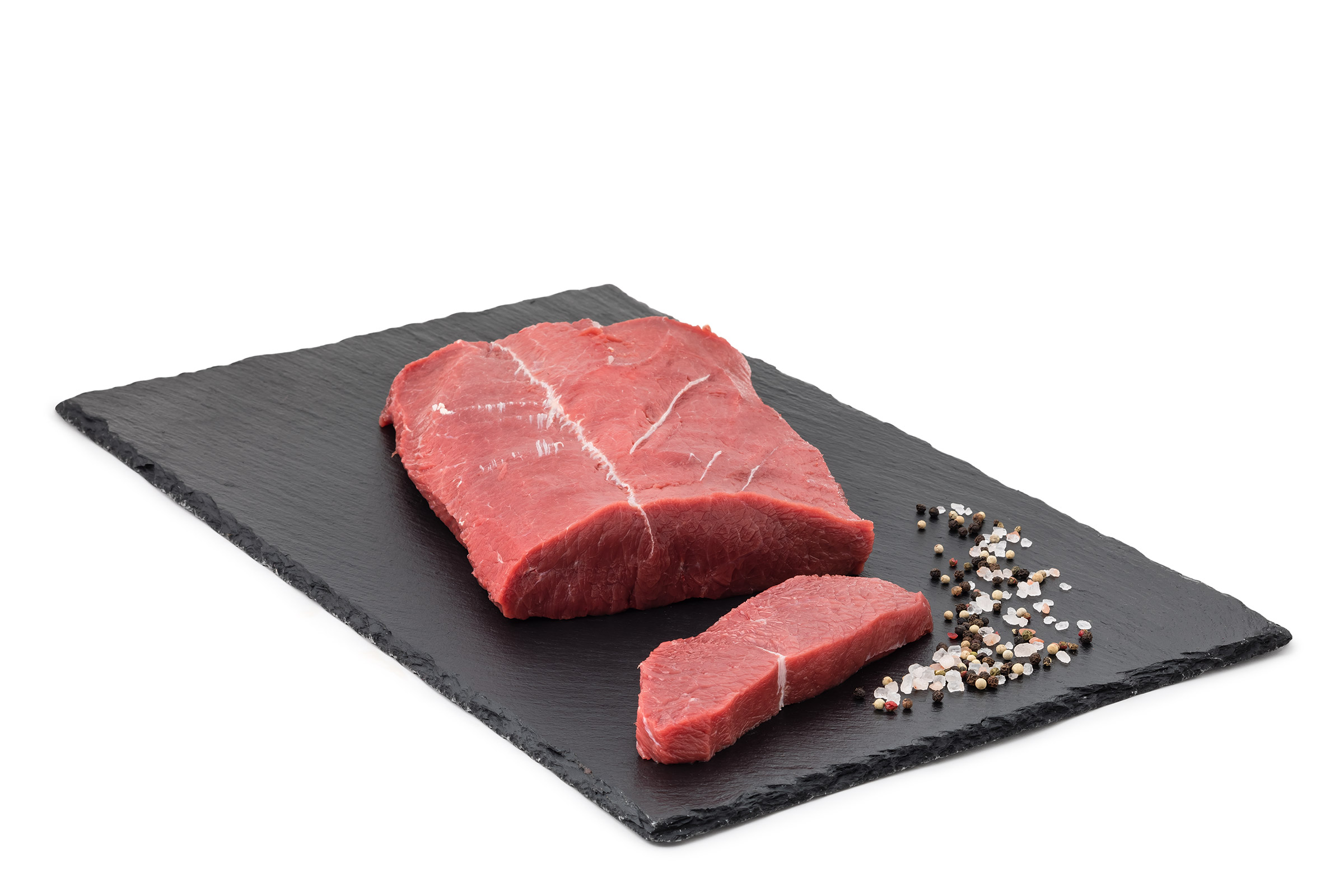 Rohes Rindfleisch auf schwarzem Stein
